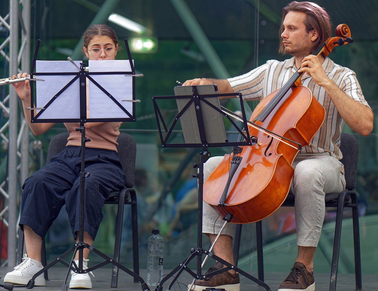 people, young, artists, playing, music, cello, flute, scene, public, evening, event, entertainment