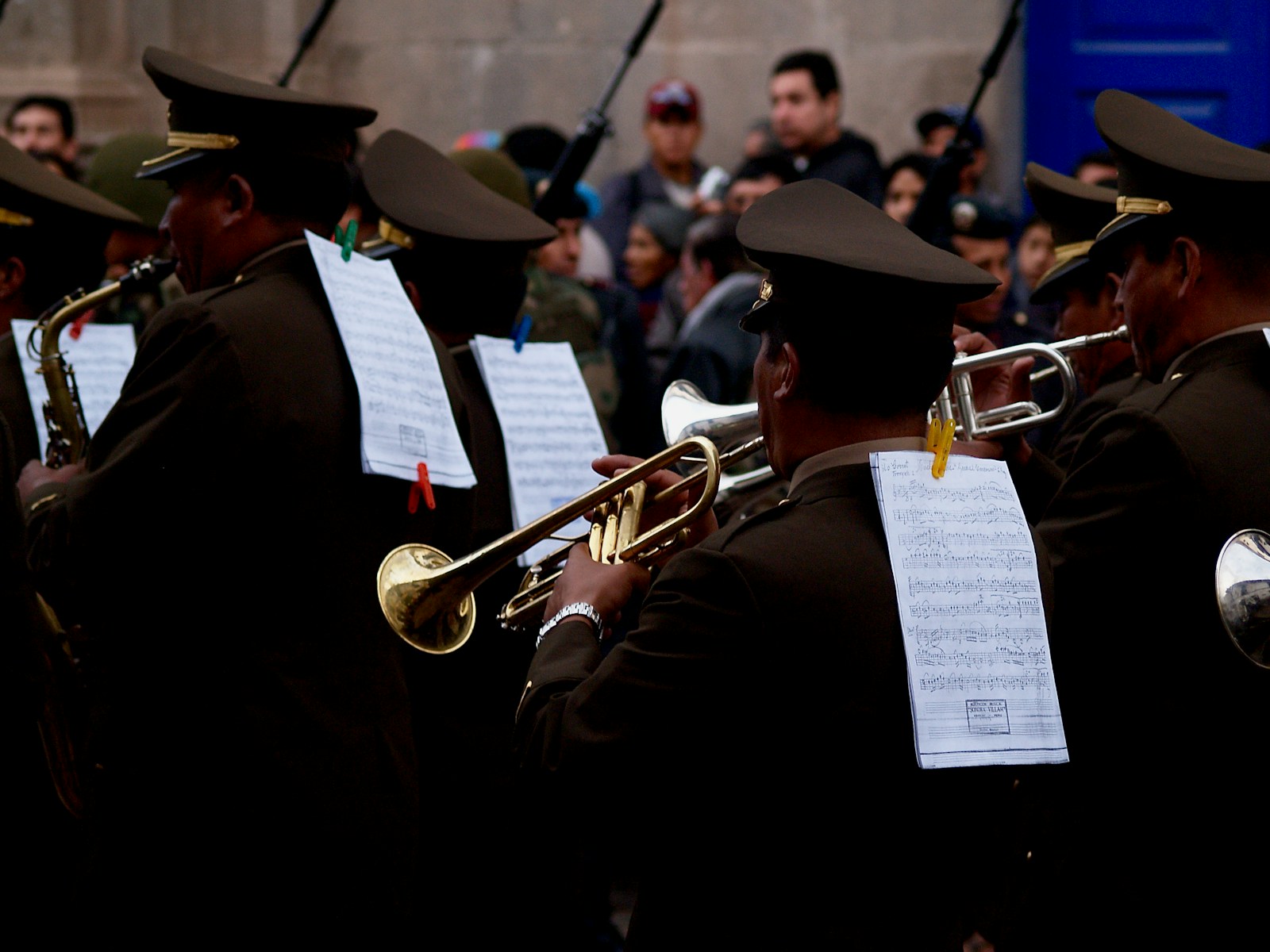 man in black hat playing trumpet